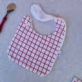 Bavoir carreaux rose fushia