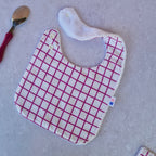 Bavoir carreaux rose fushia